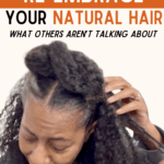 black woman with her hands in her hair encouraging embracing natural hair