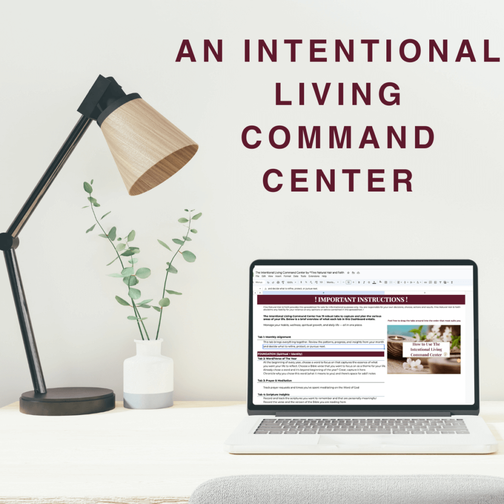 Lifestyle mockup of the Intentional Living command center open on a laptop beside a desk lamp and plant.