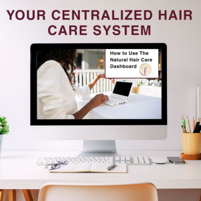 Woman using The Natural Hair Care Dashboard on desktop showing centralized system for tracking natural hair routines and progress