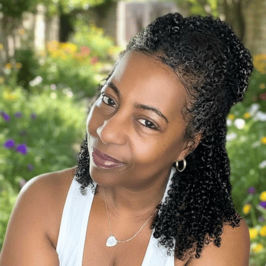 half up half down curly hairstyle on natural hair, floral background