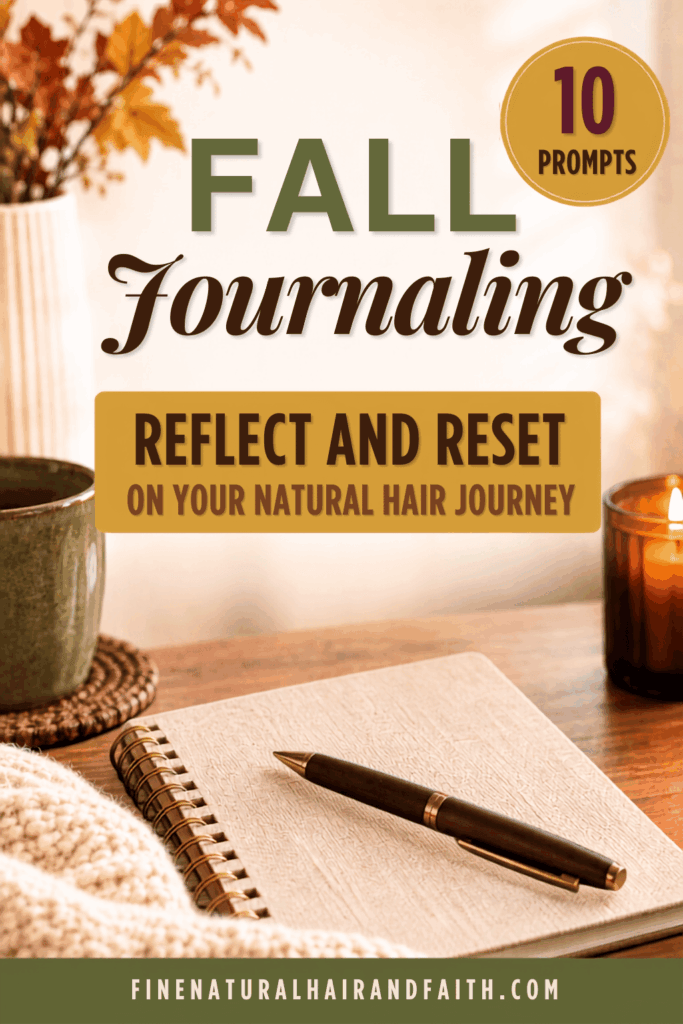 Open journal and pen on a wood table with a warm drink, candle and fall leaves, for fall journal prompts to reflect on your natural hair.