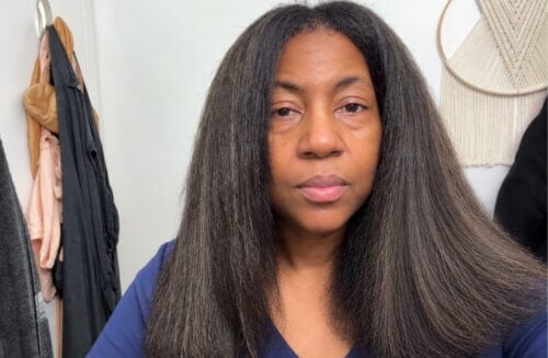 straightened natural graying hair on a black woman