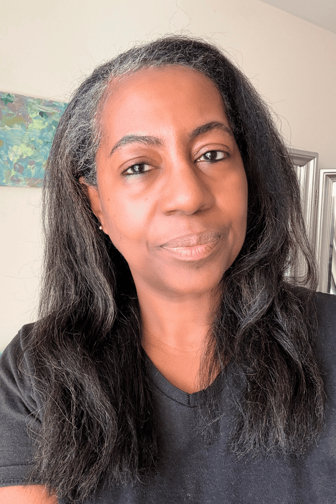 black woman with fluffy pressed graying natural hair
